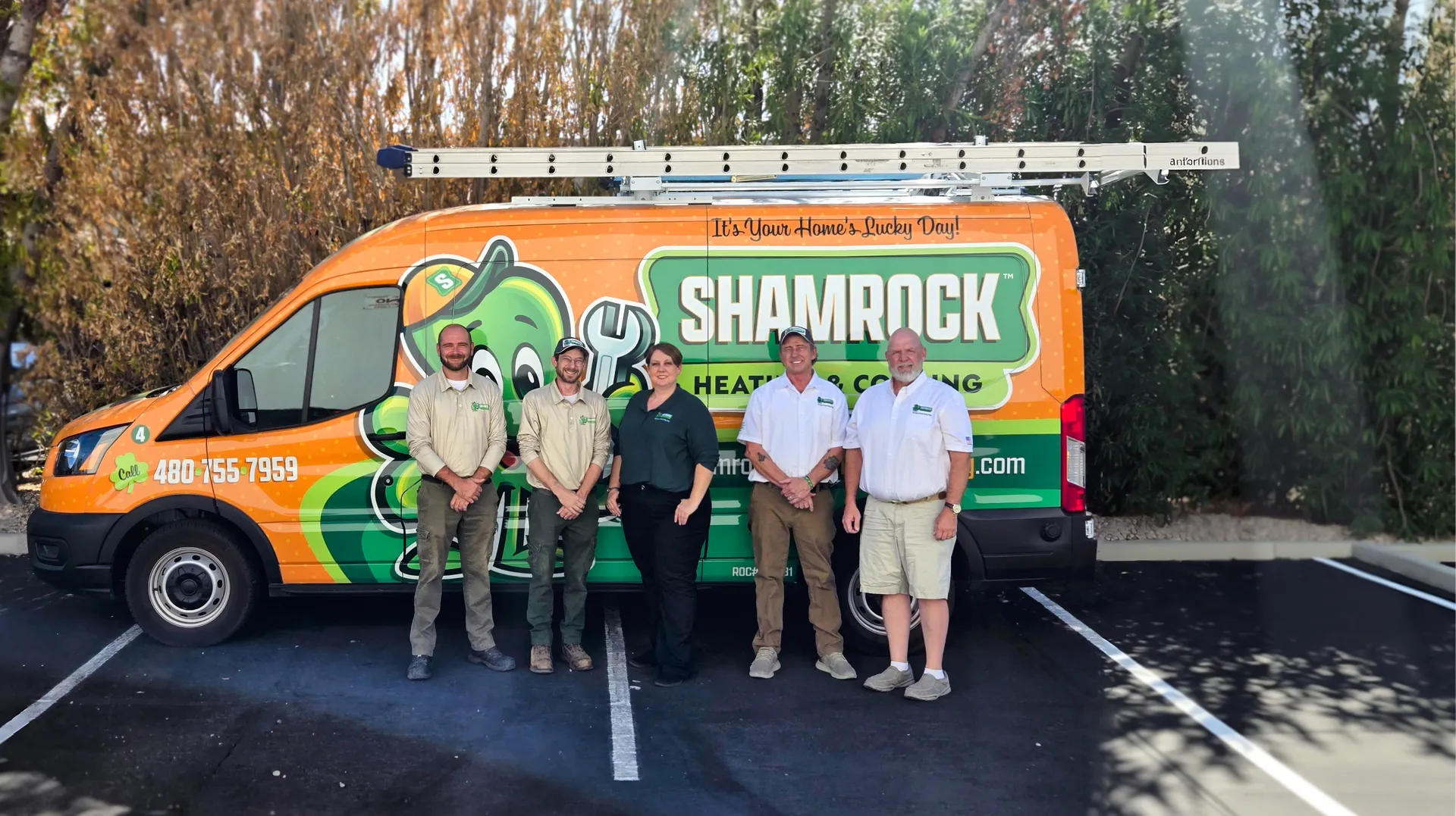 Shamrock Heating and Cooling HVAC Team standing in front of the HVAC Service Van